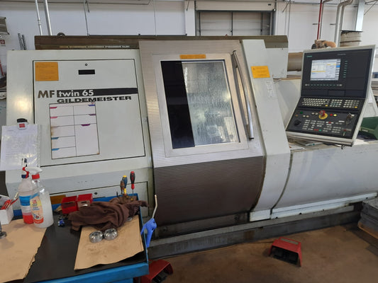 Tornio CNC bimandrino GILDEMEISTER MF Twin 65 usato con caricatore IEMCA il Metalmeccanico Di M